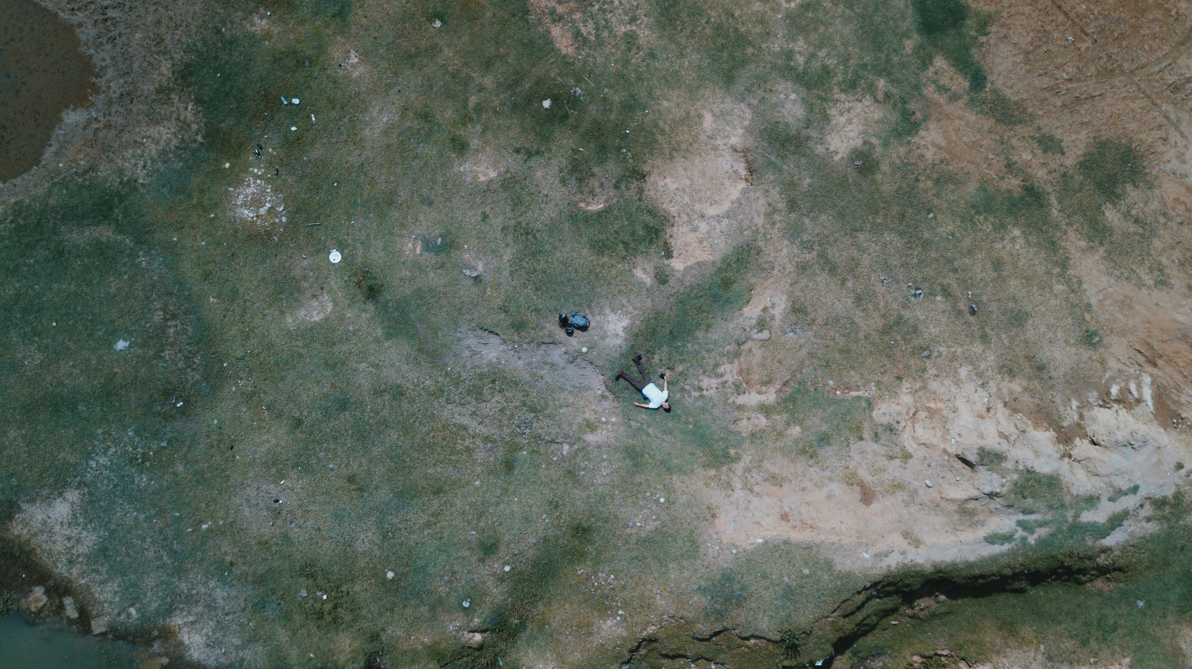 bird's eye-view photo of man lying on the floor